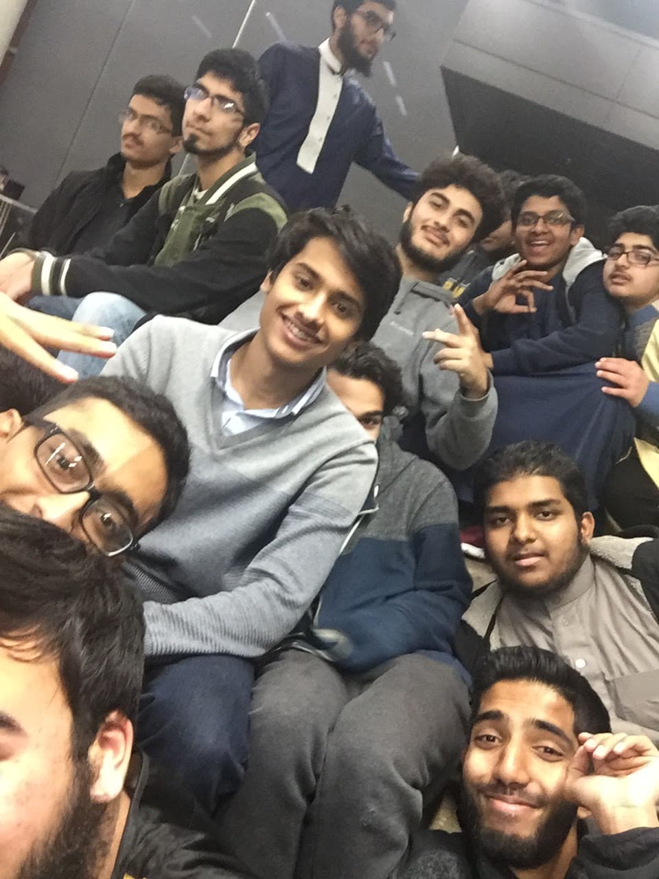 A group of students laughing together in a candid selfie