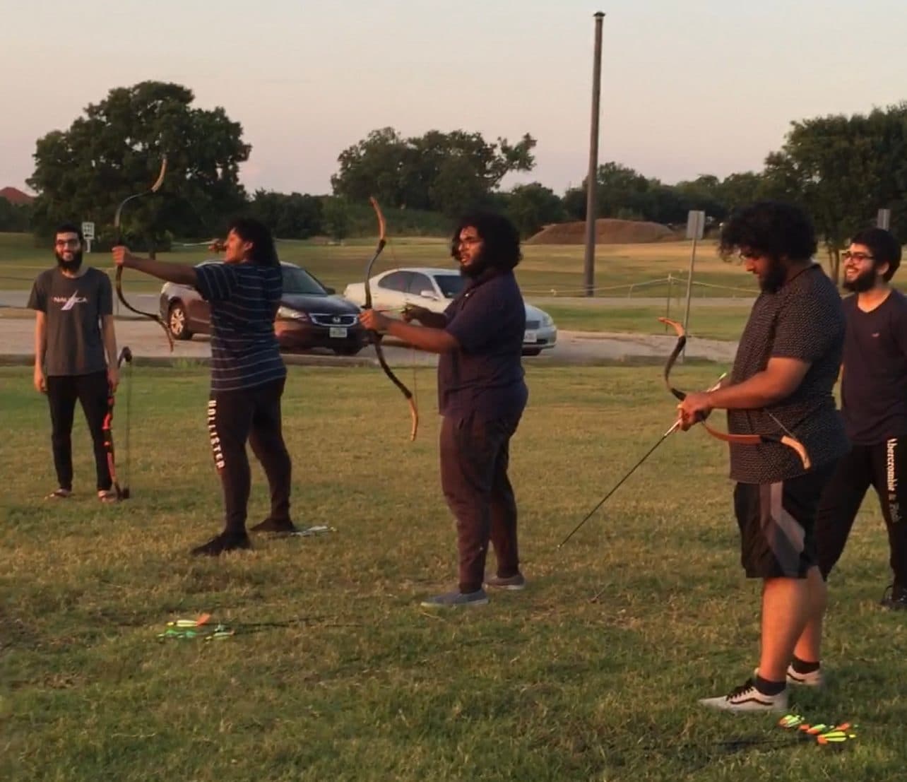 Students shooting bows at an archery outing in Plano, 2019