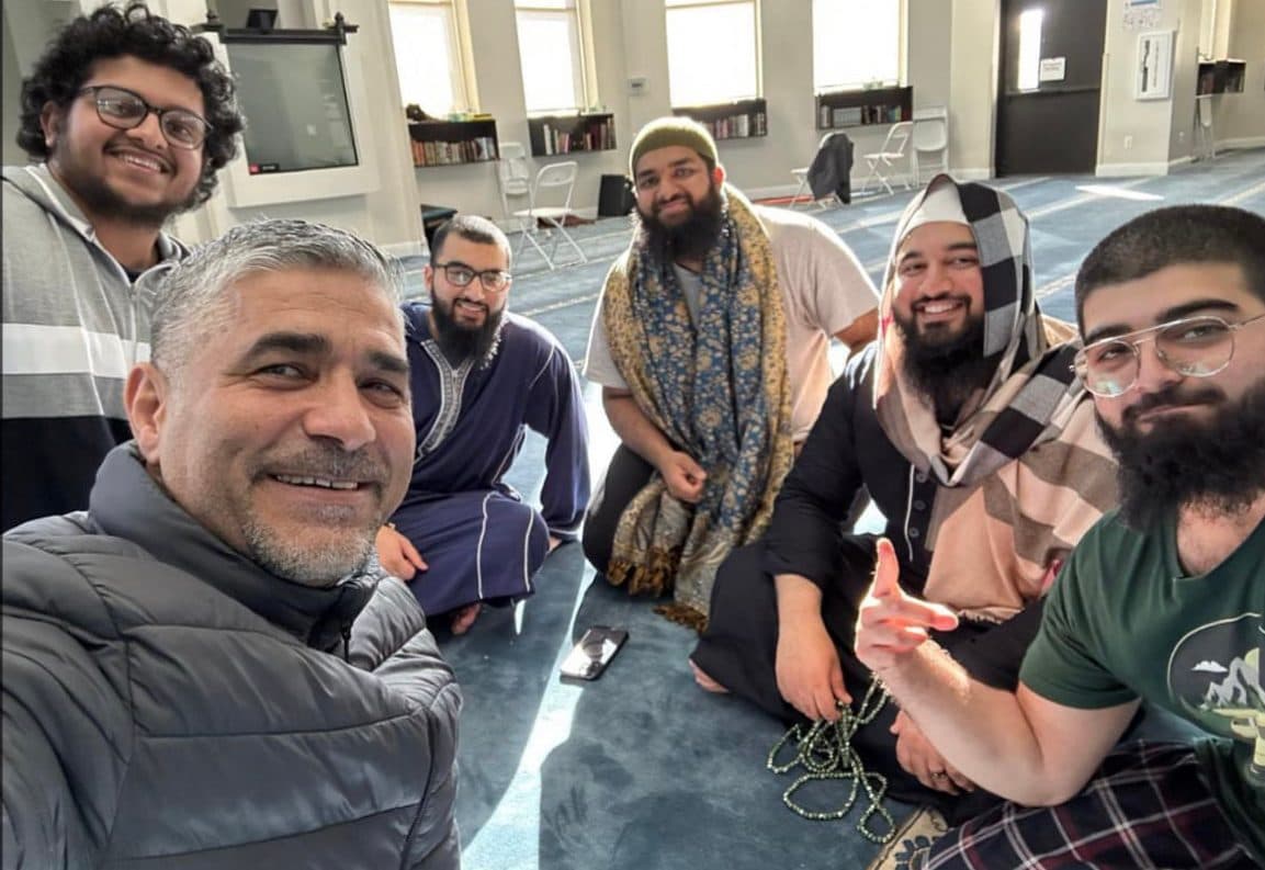 A post-fajr circle selfie on the masjid floor