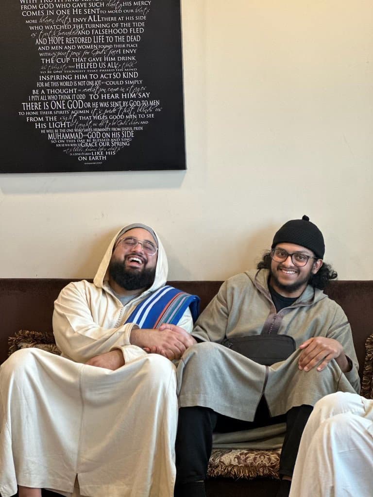 Two students laughing together during a one-on-one session