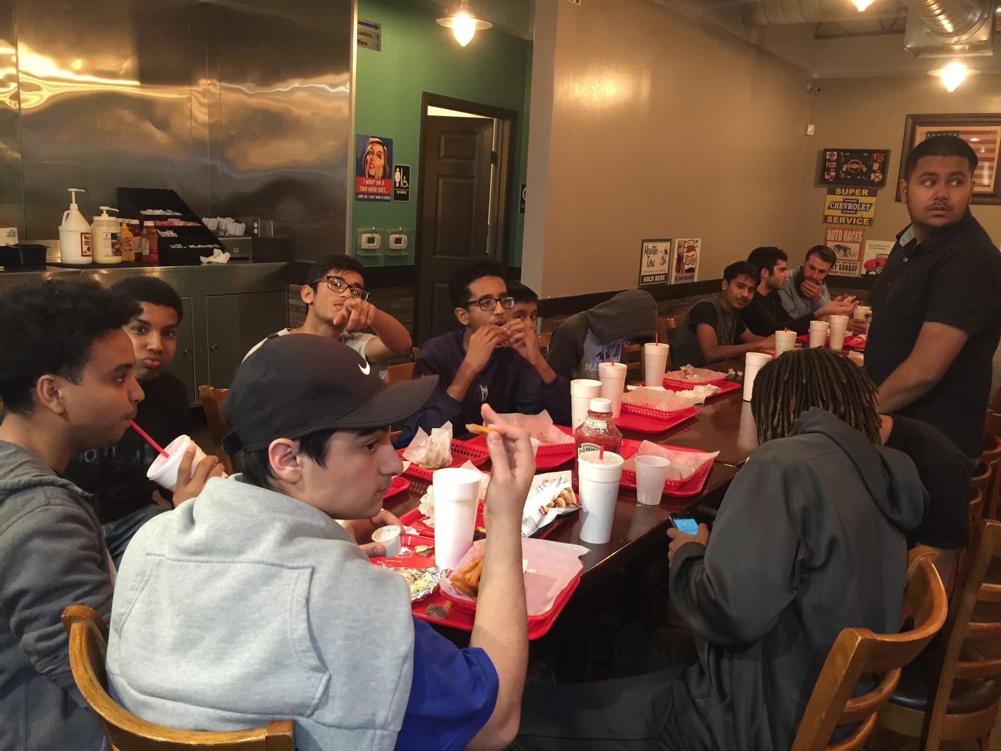 Students sharing a meal together at a restaurant