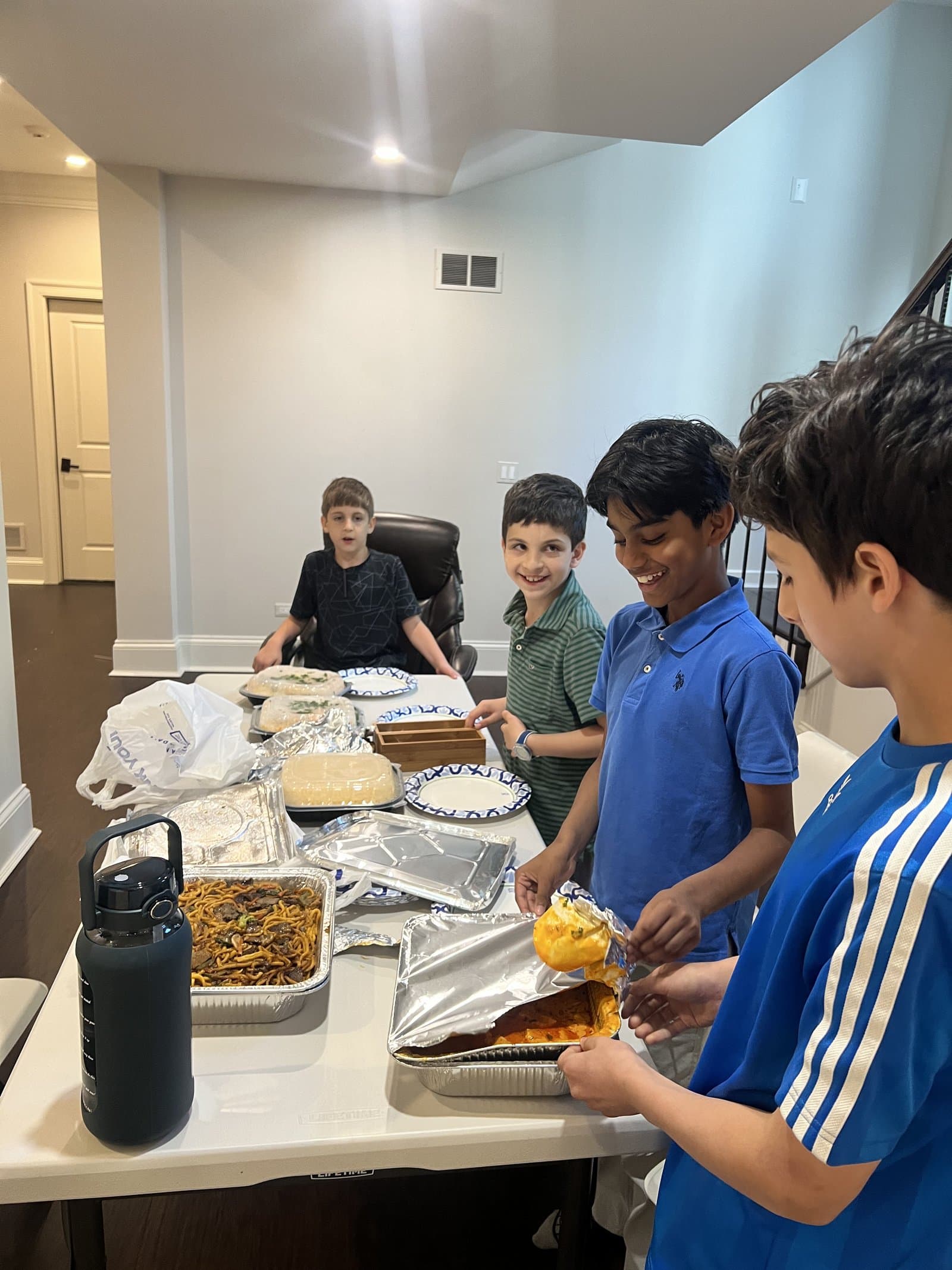 Irslan laughing warmly with a student in Chicago