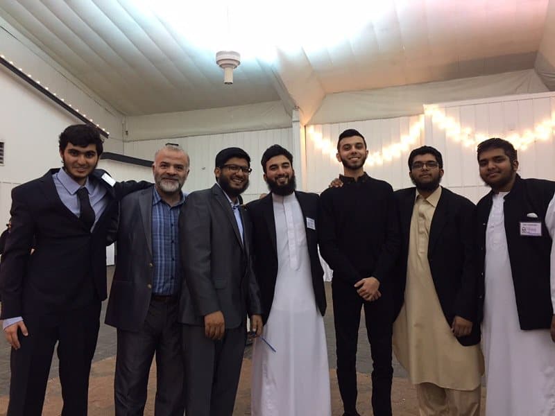 Irslan with a group of young men and an elder at an EPIC Masjid event