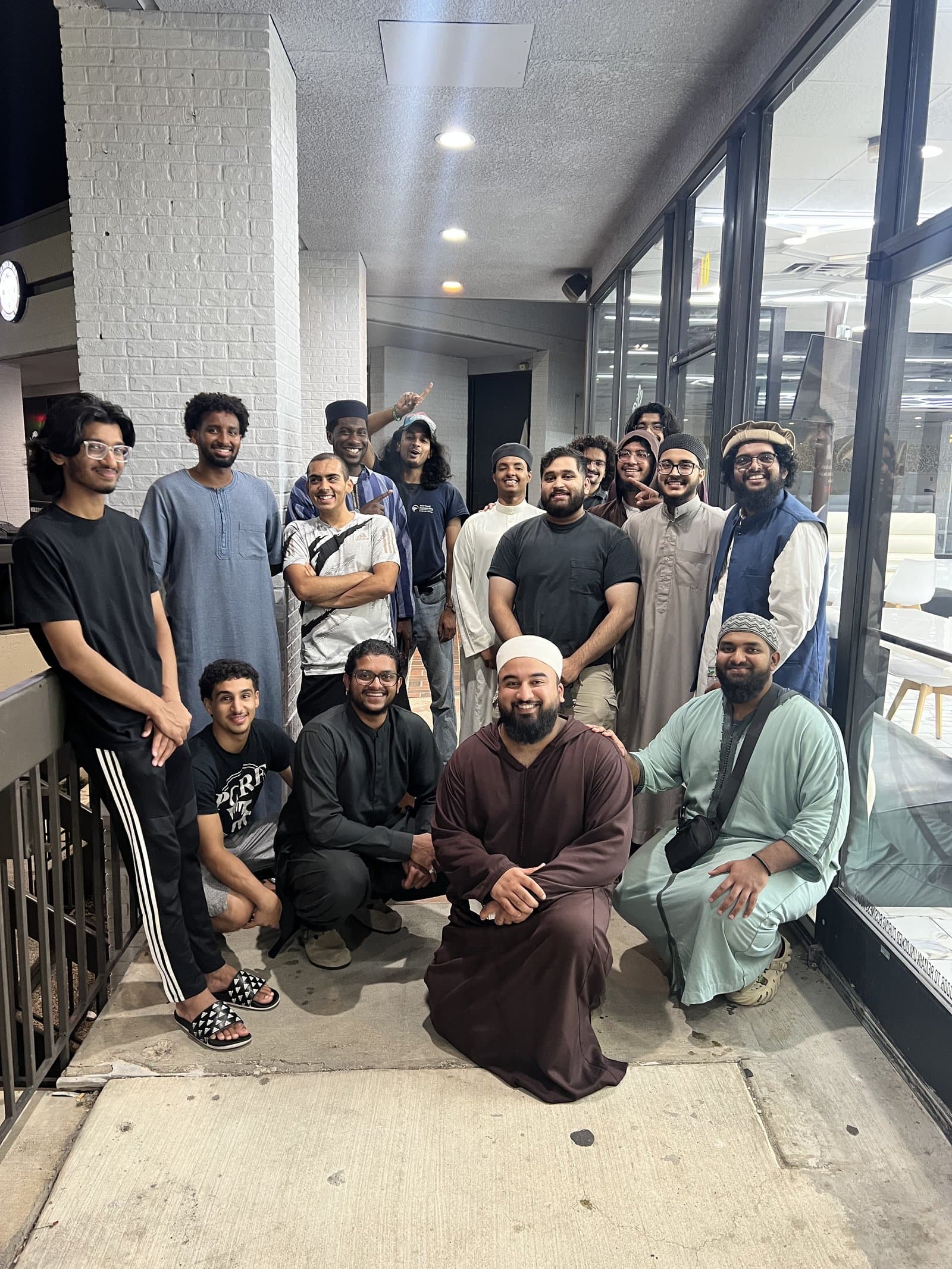 A large joyful group photo on a return visit to Richardson
